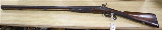 A 19th century twin barrel percussion cap shotgun overall length 109cm (a.f)